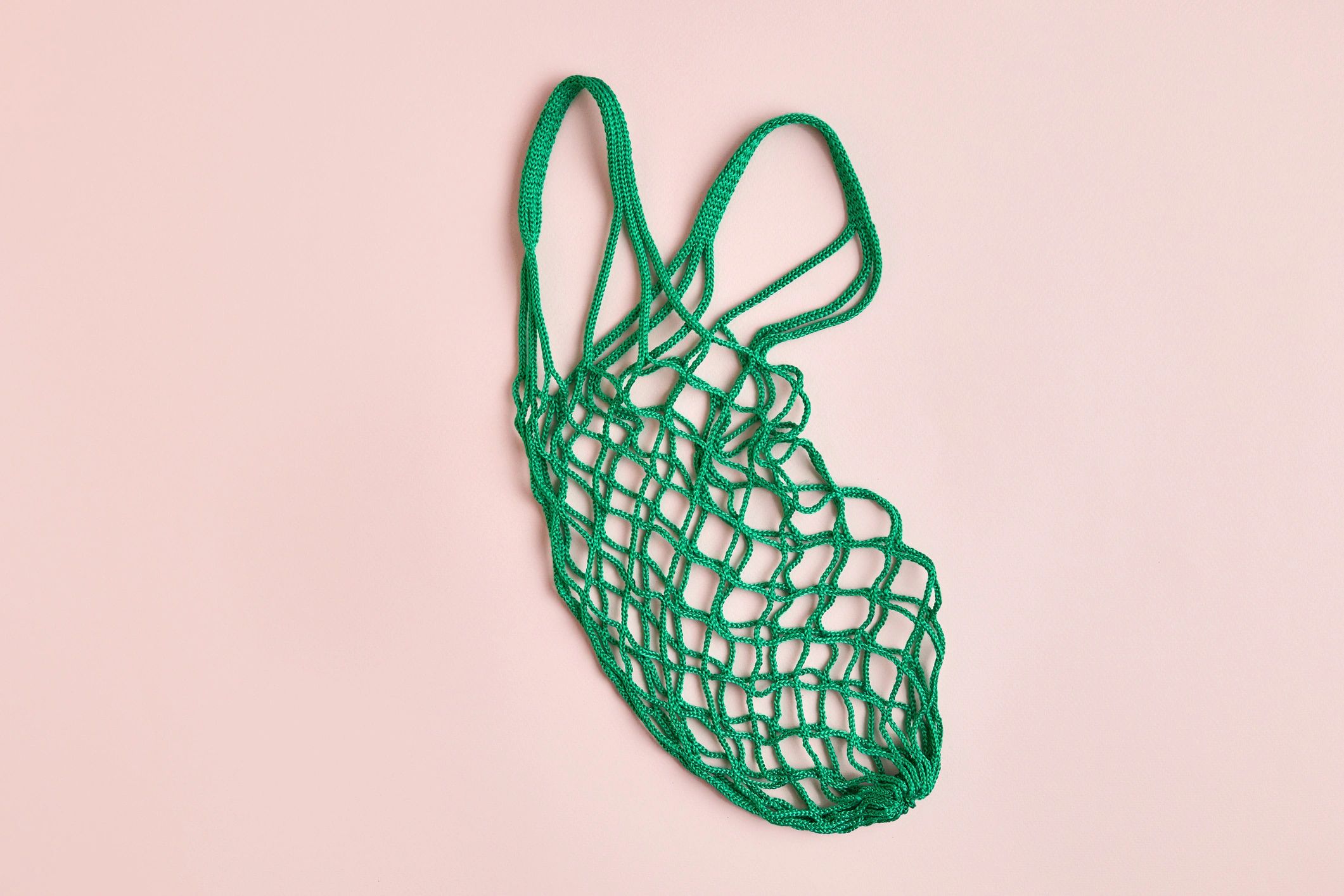 Mesh crochet shopping bag with vegetables and fruit