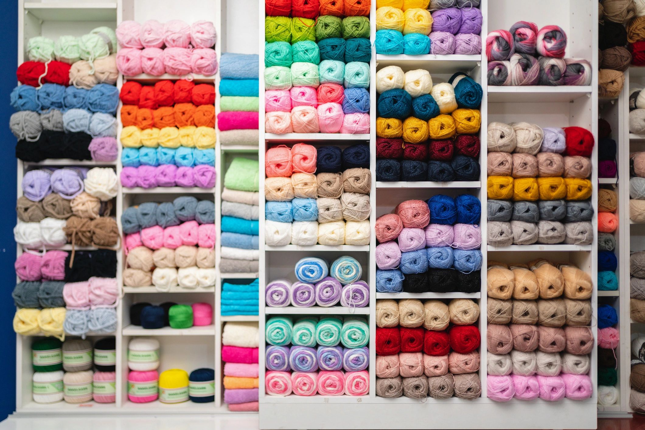 Colorful balls of wool on a shelf