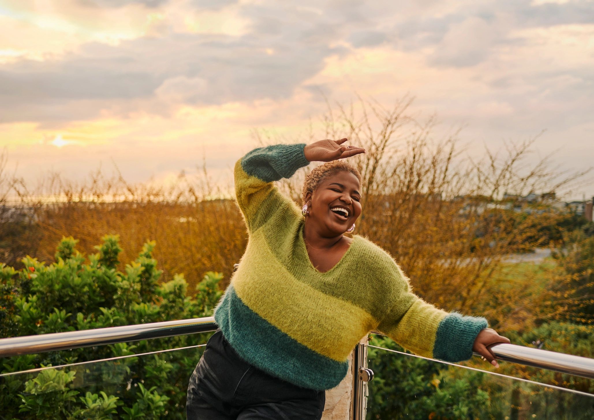 Model wearing a cozy handmade crochet sweater outdoors