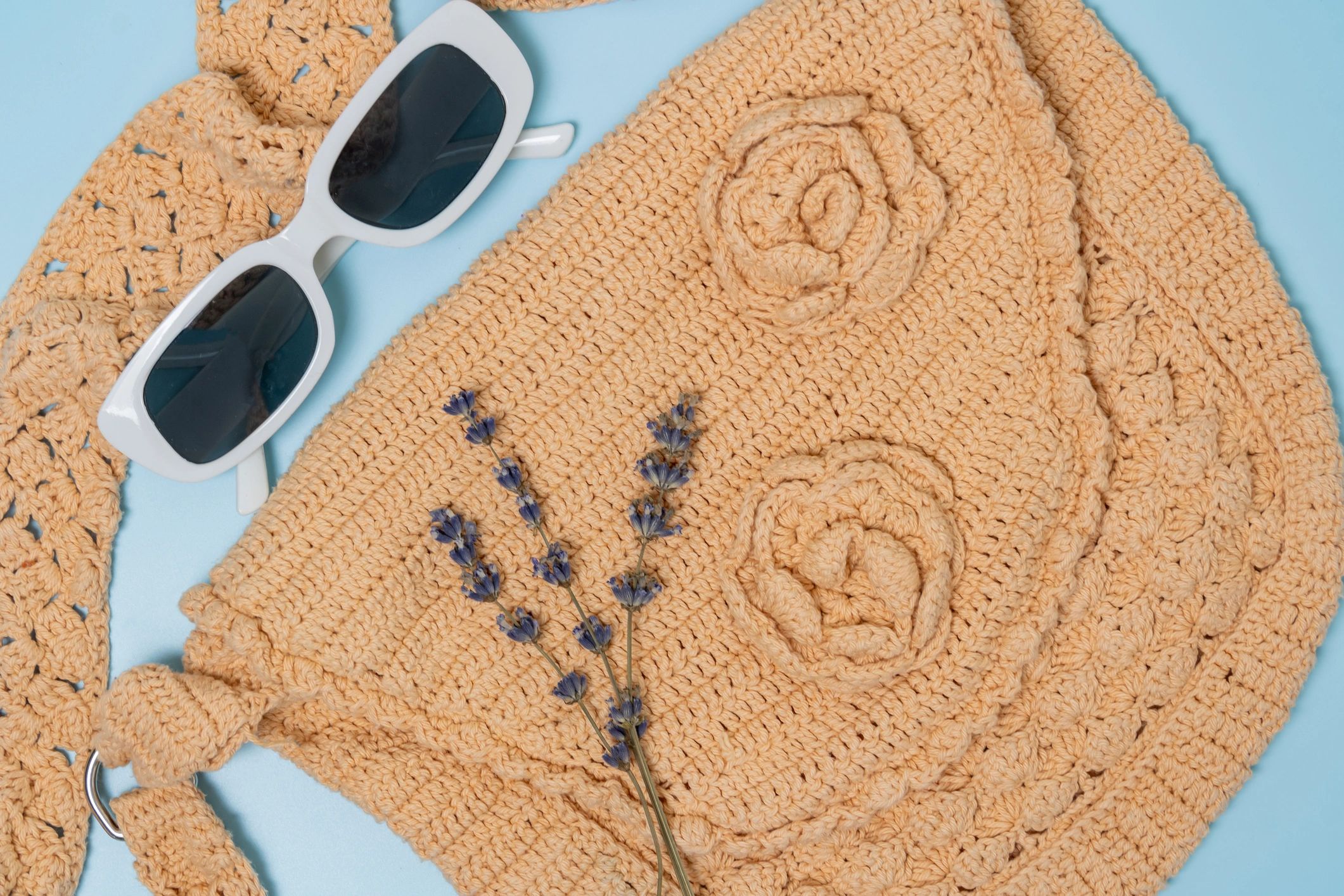 Handmade crochet bag styled with accessories