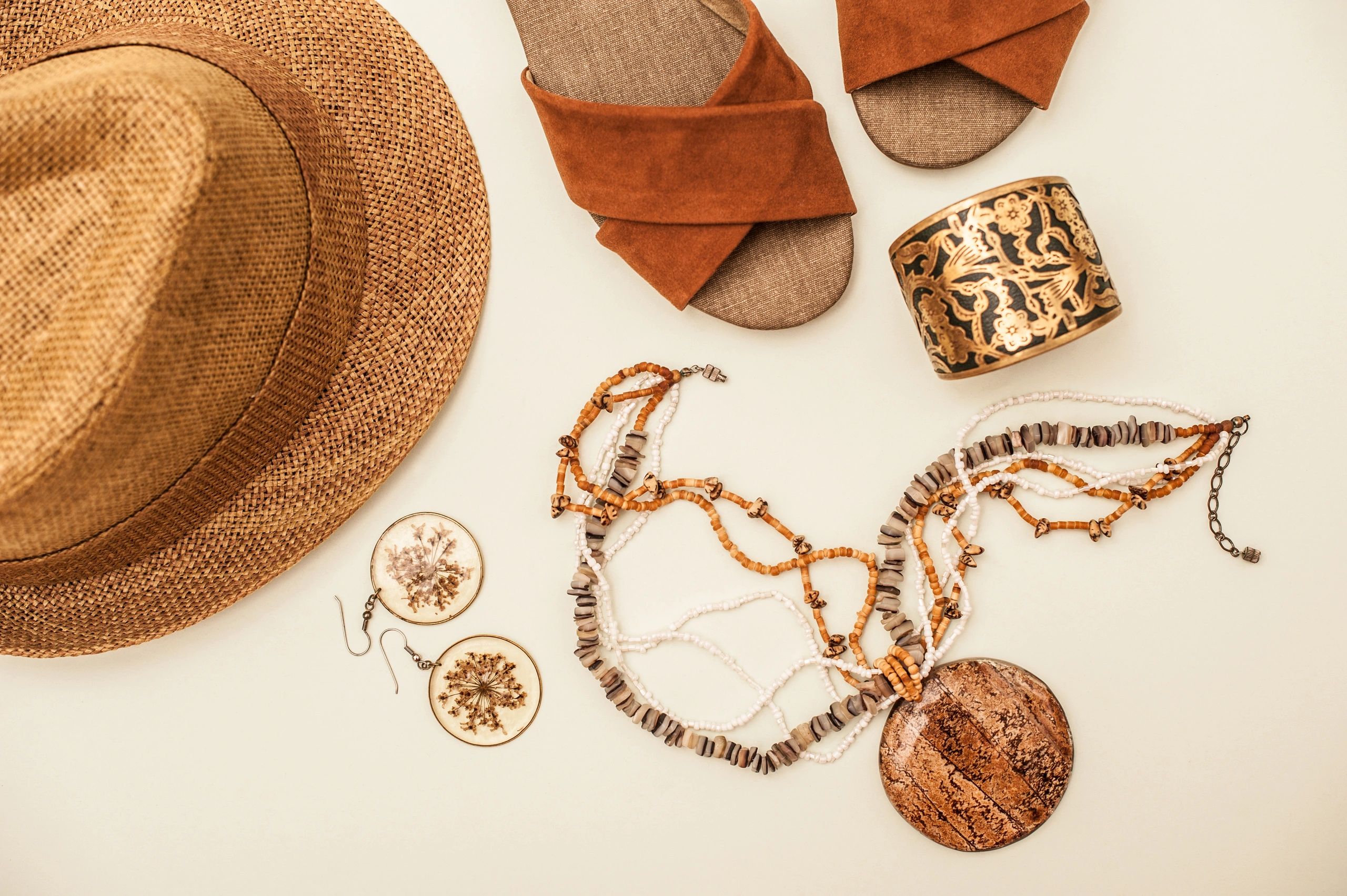 Boutique fashion accessories styled on white background